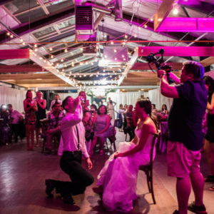 Groom gets iced during garter toss at the Farmers Market